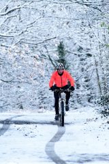 A cyclist out in the snow in Honley, Holmfirth.